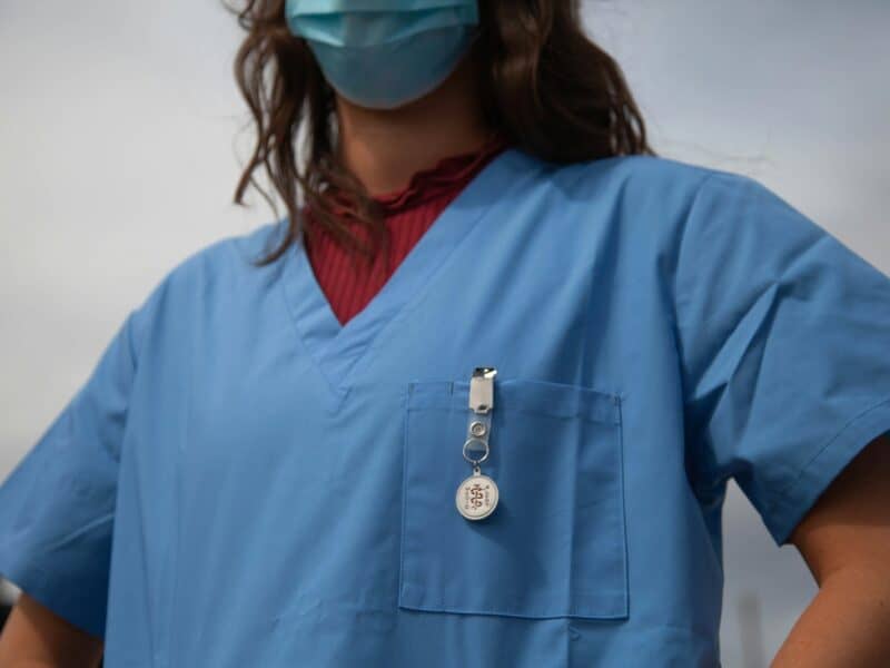 woman in red shirt wearing blue goggles