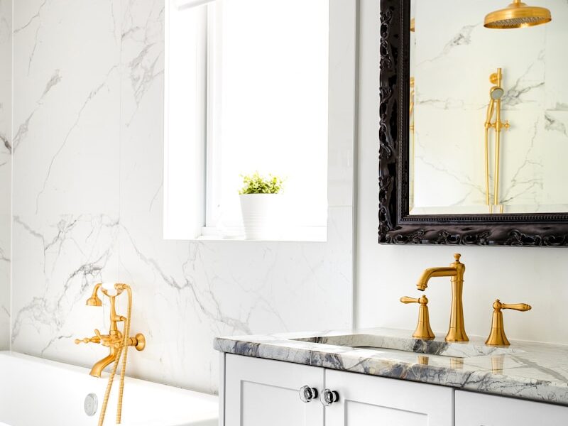 white ceramic bathtub with faucet