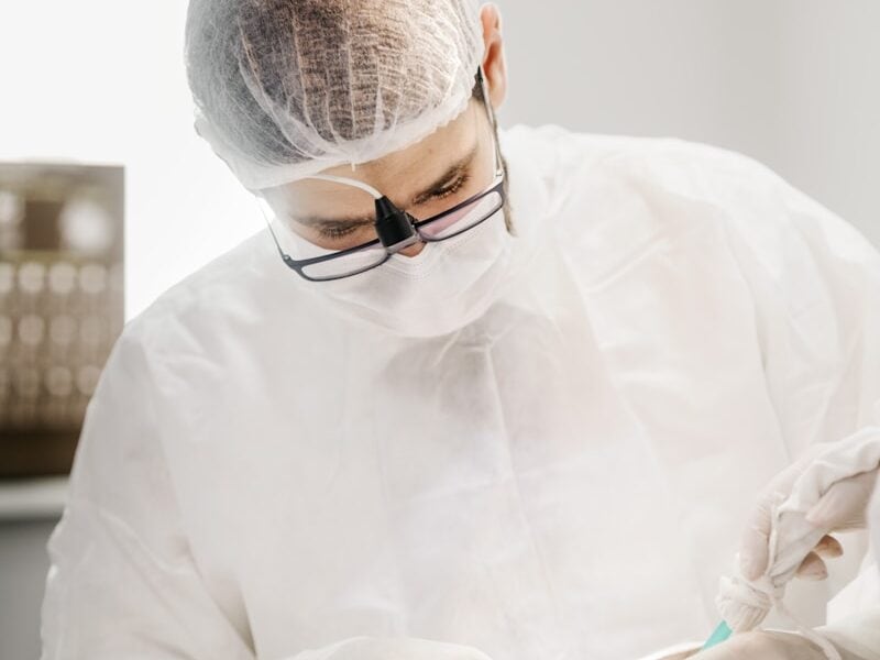 man in white dress shirt wearing black framed eyeglasses
