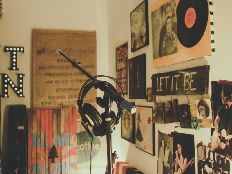 black condenser mic with stand and headphones