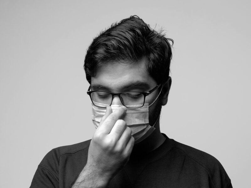 man in black crew neck shirt wearing black framed eyeglasses