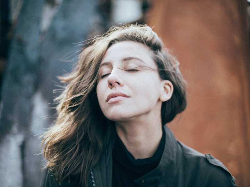 closeup photo of woman wearing black top